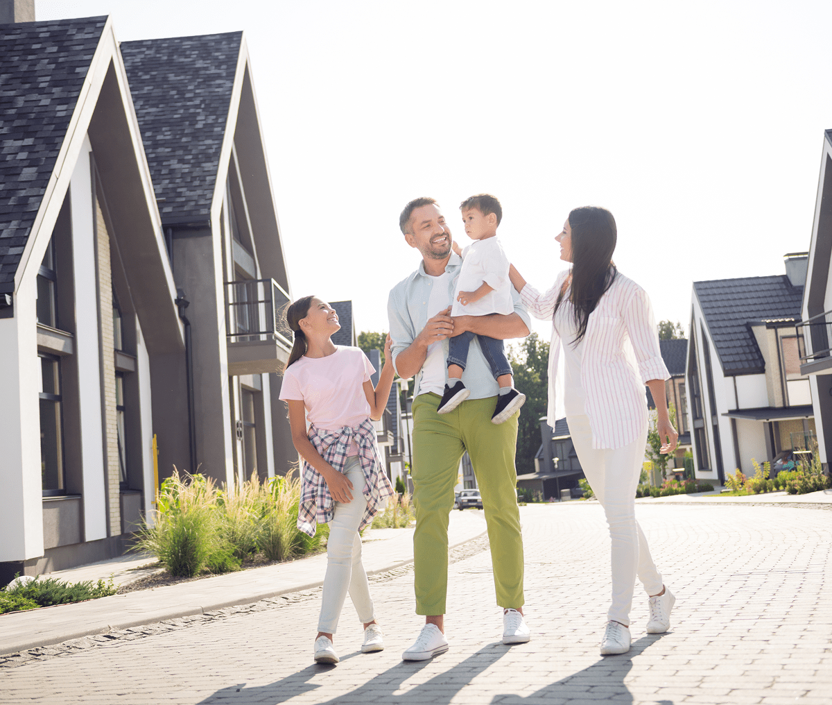 Family walking in suburban neighborhood