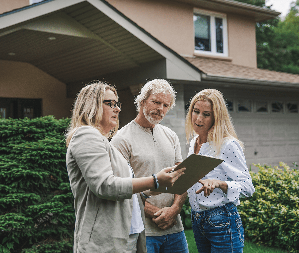 Homebuyers consulting with real estate agent