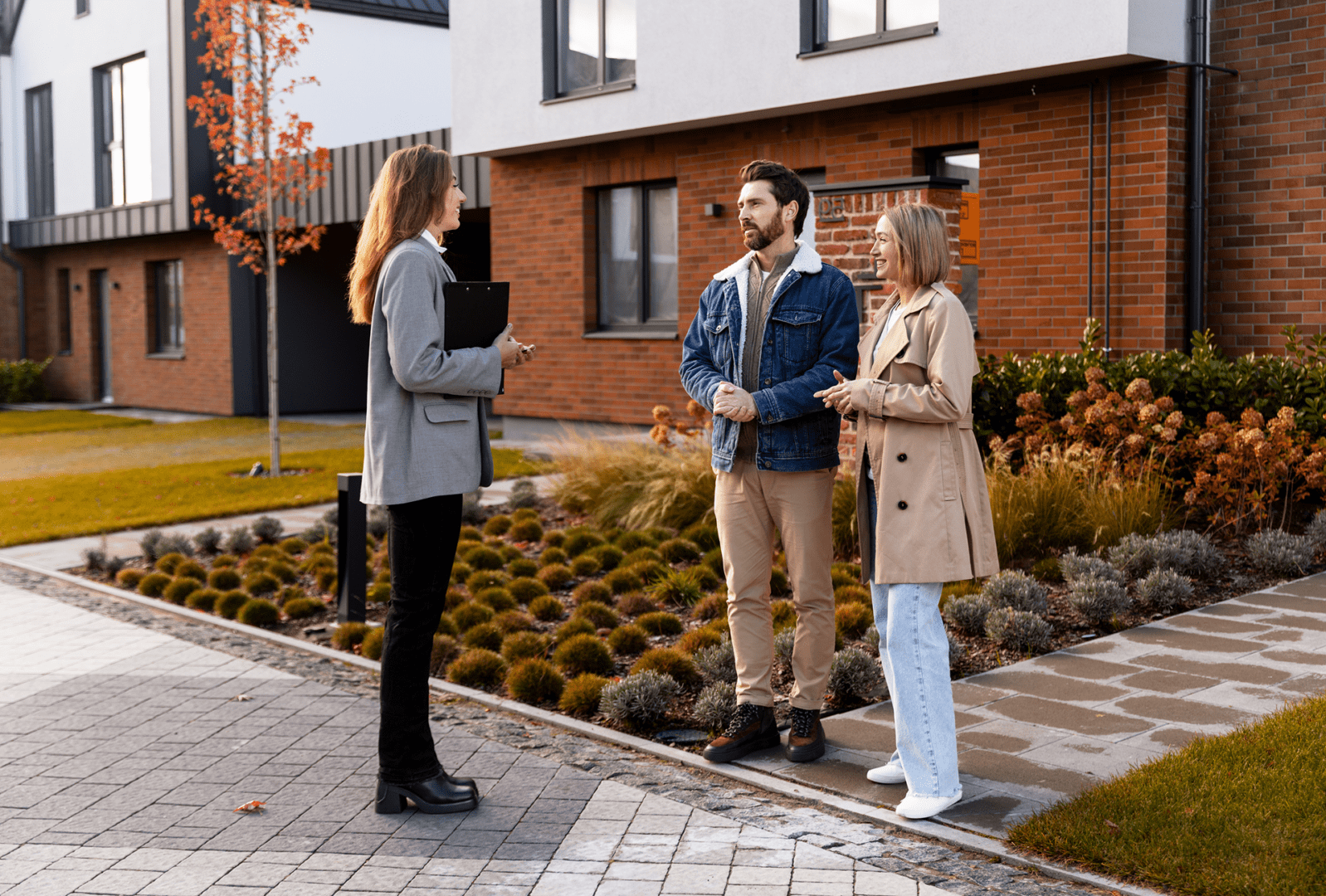 Real estate agent showing house to couple
