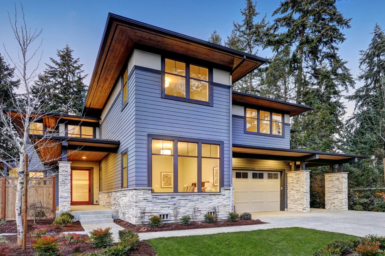 Contemporary home surrounded by tall trees